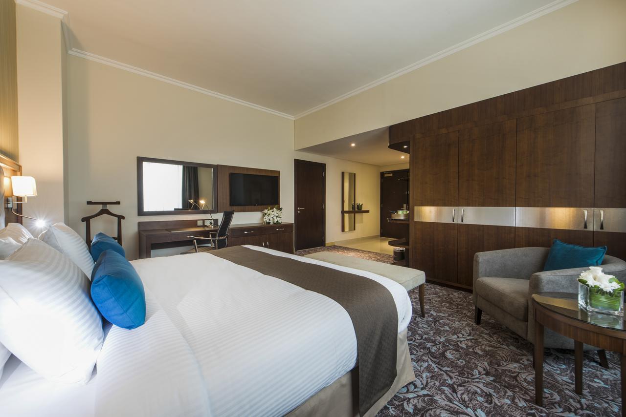 Golden Tulip Doha Hotel Exteriör bild Deluxe room